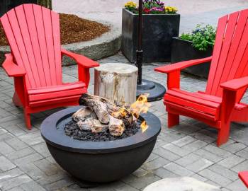 Adirondack chairs set up near a firepit at Jarvis Creek General Store